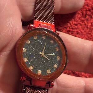 Elegant dark red Watch with gold tone Dial & dark red band .
